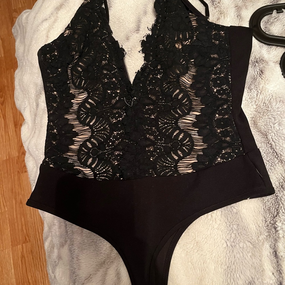 Windsor- Black and tan lace body suit with adjustable straps.